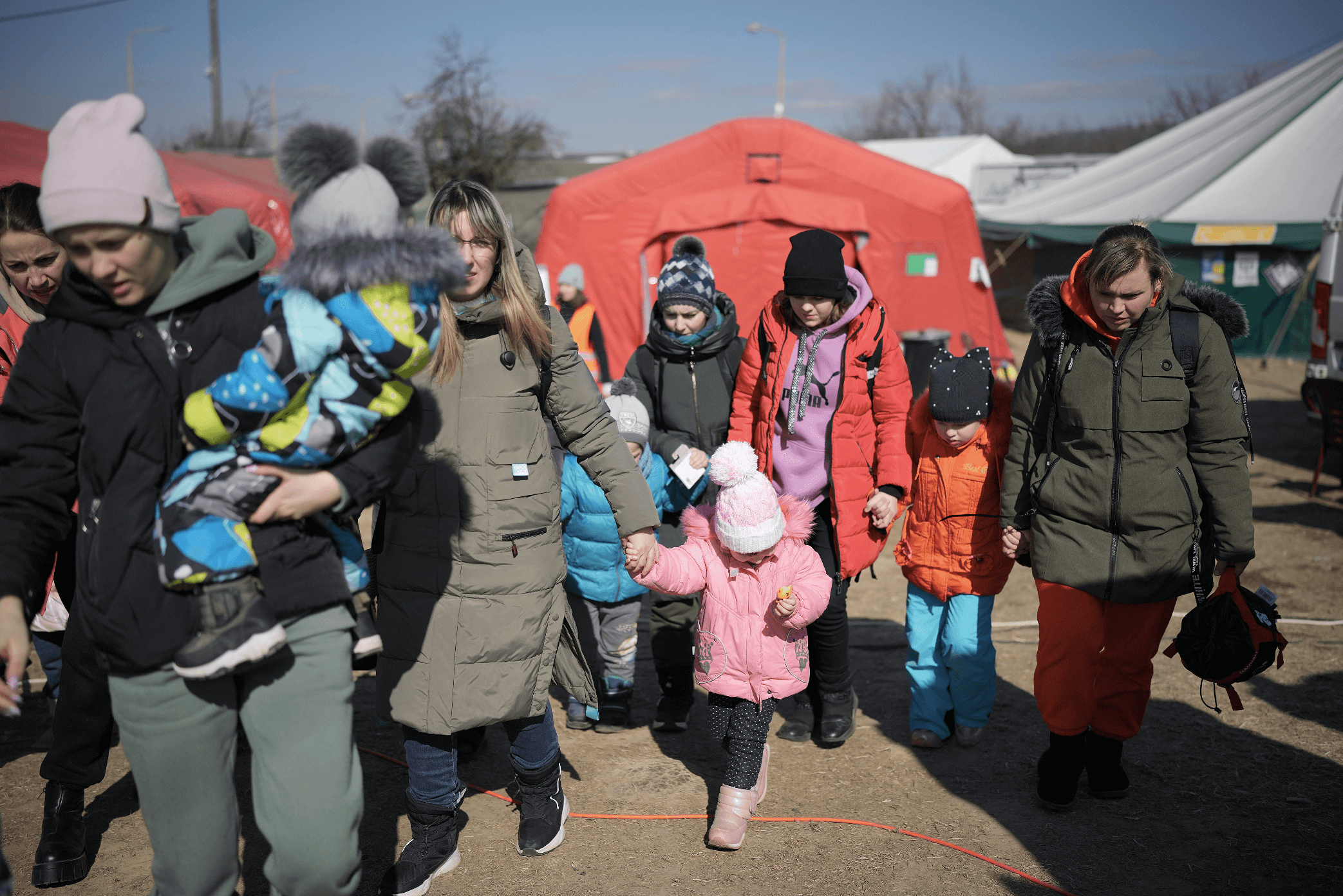 REFUGEES-FLEEING-UKRAINE-REST-AND-ARE-GIVEN-FOOD-BY-THE-INTERNATIONAL-RED-CROSS-AND-OTHER-CHARITABLE-ORGANISATIONS-AT-THE-VYSNE-NEMECKE-BORDER